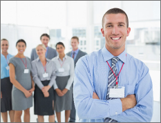 businessman-smiling-camera-with-team-him